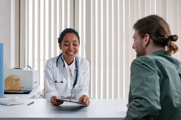 Healthcare provider reviewing GLP-1 medication eligibility criteria with a patient