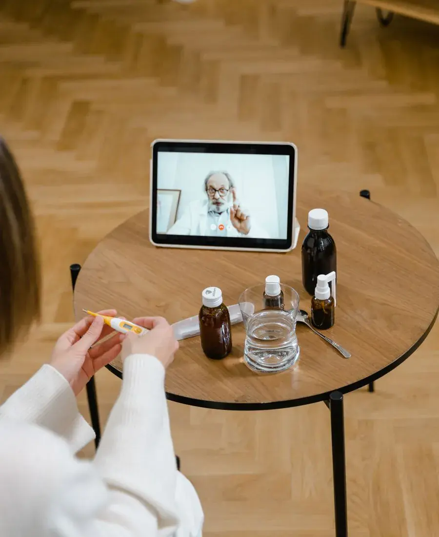 Patient completing a telehealth consultation on a digital tablet for tirzepatide prescription evaluation